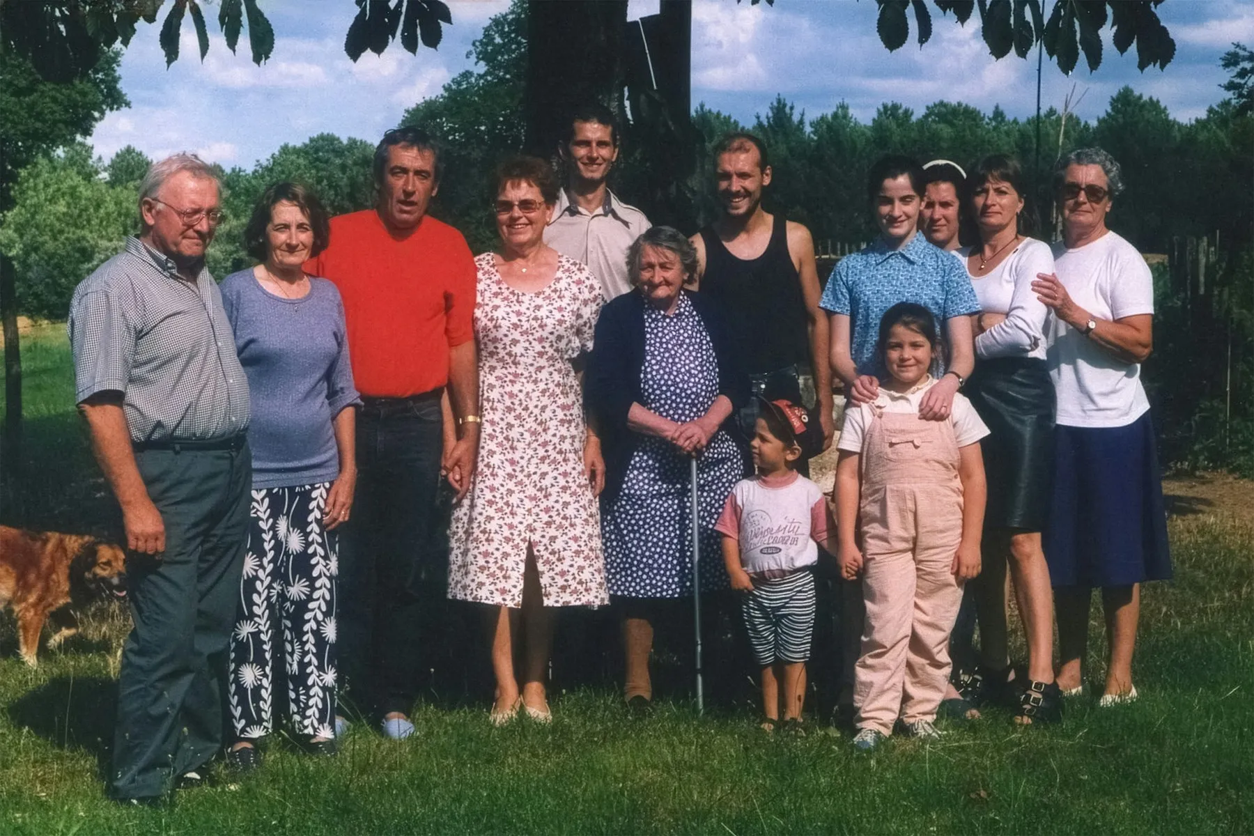 A multi-generational family together outdoors